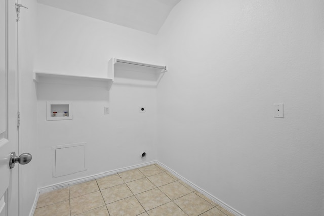 laundry area featuring hookup for an electric dryer, light tile patterned floors, and washer hookup