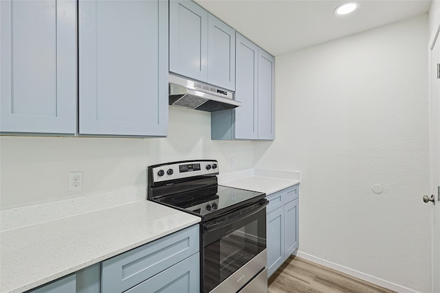 kitchen featuring light hardwood / wood-style floors and stainless steel electric stove