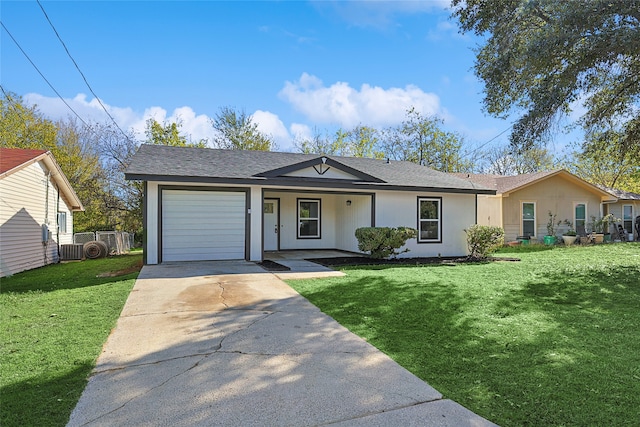 single story home featuring covered porch, a garage, a front lawn, and central air condition unit