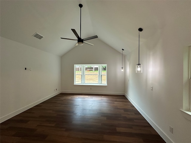 unfurnished living room with ceiling fan, lofted ceiling, and dark wood-type flooring