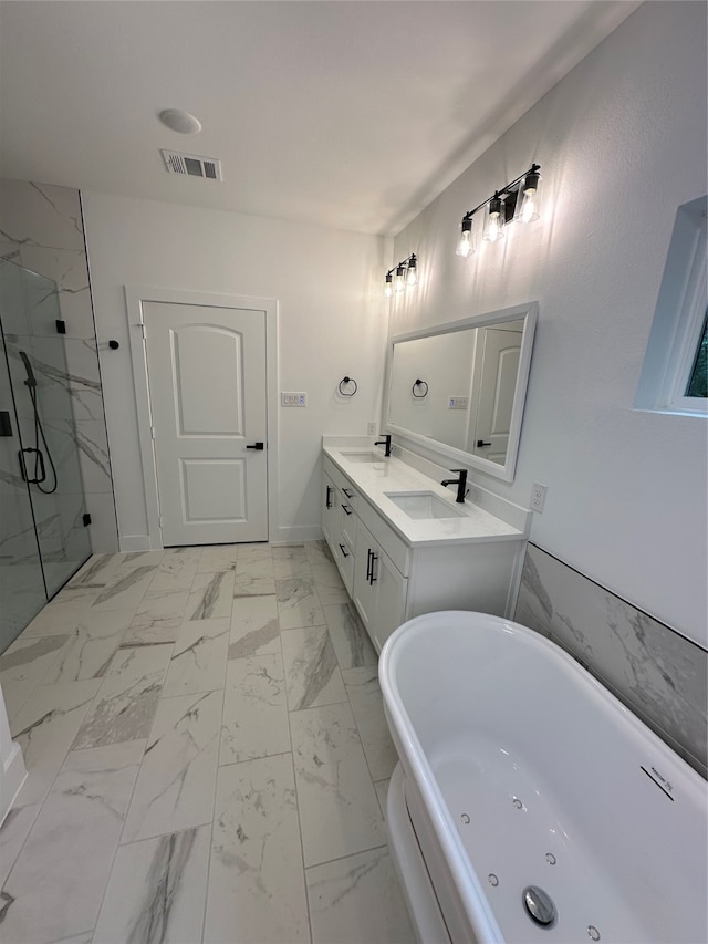 bathroom with vanity and independent shower and bath