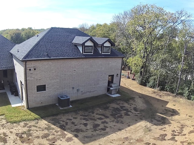 view of property exterior featuring a patio area