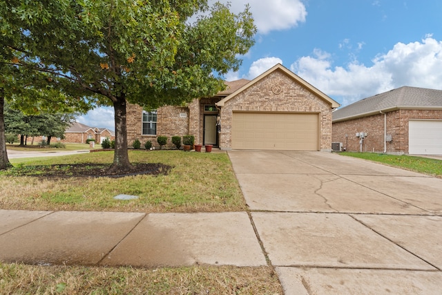 view of front of home with a garage, a front lawn, and cooling unit