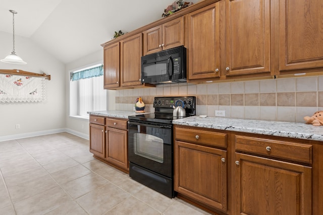 kitchen with hanging light fixtures, tasteful backsplash, vaulted ceiling, light tile patterned floors, and black appliances