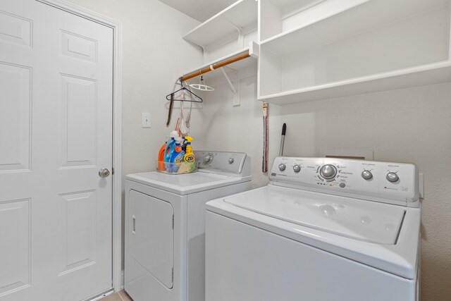 laundry room featuring washing machine and clothes dryer