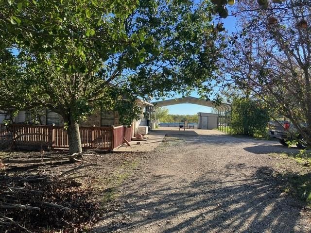 5487 Fm 512, Commerce, TX 75428 - view of yard with a detached carport and fence