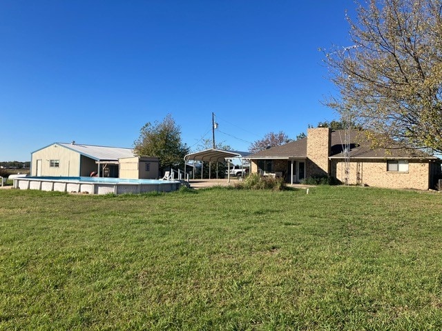 view of yard with a carport