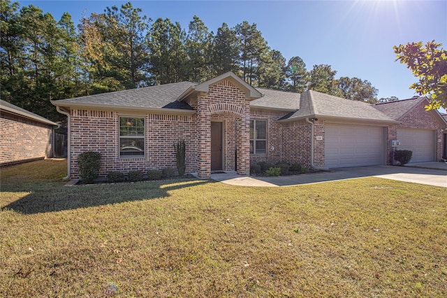 ranch-style home with a front yard and a garage