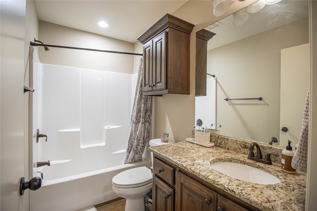 full bathroom featuring vanity, wood-type flooring, shower / bath combo, and toilet