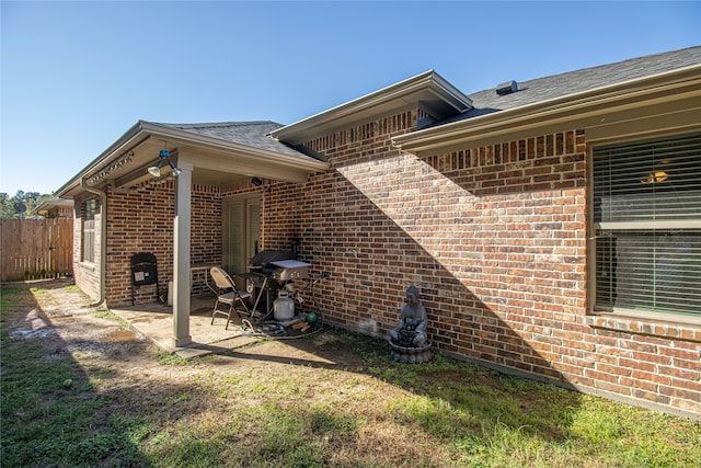 view of property exterior with a patio