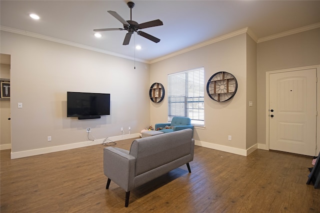 living room featuring ceiling fan, dark hardwood / wood-style flooring, and crown molding