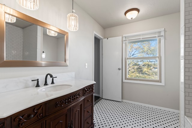 bathroom featuring a textured ceiling and vanity