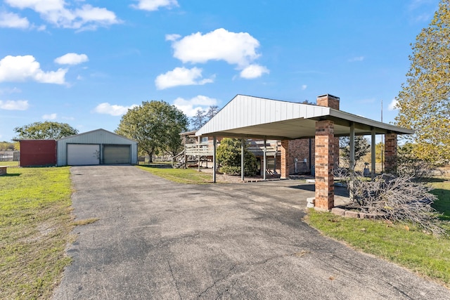 exterior space with an outbuilding and a garage