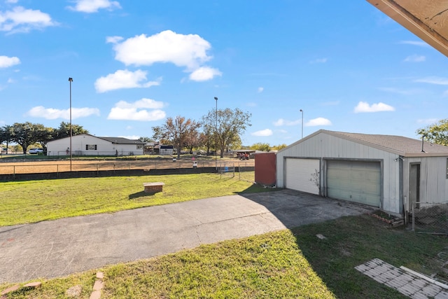 garage featuring a lawn