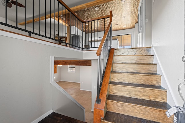 stairs featuring tile patterned floors