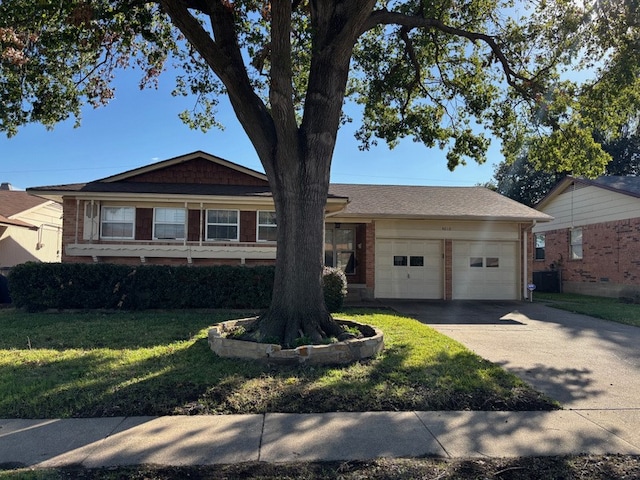 ranch-style house with a front yard and a garage