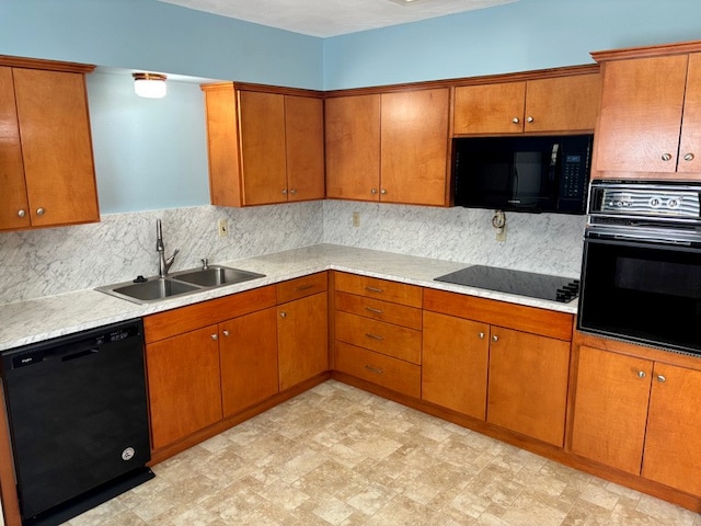 kitchen featuring sink, backsplash, and black appliances