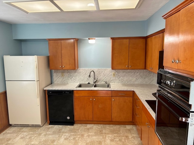 kitchen with decorative backsplash, sink, and black appliances