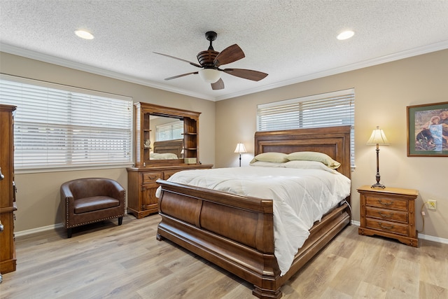 bedroom with ceiling fan, light hardwood / wood-style floors, ornamental molding, and a textured ceiling