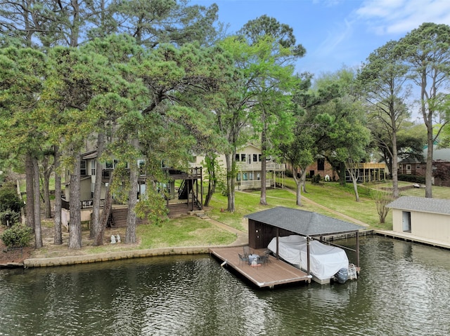 dock area featuring a water view and a lawn