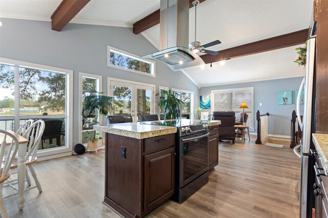 kitchen featuring ceiling fan, electric stove, light hardwood / wood-style flooring, and french doors