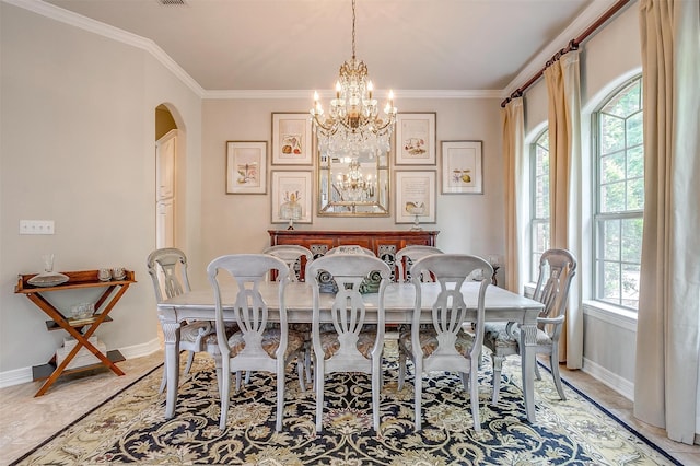 dining room featuring a wealth of natural light, a chandelier, and ornamental molding