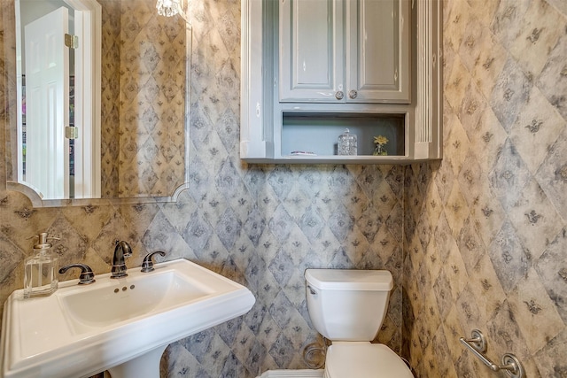 bathroom featuring sink and toilet