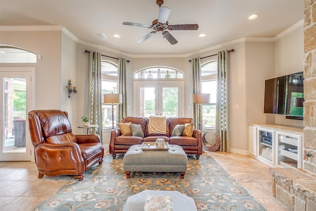 living room with crown molding, french doors, and ceiling fan