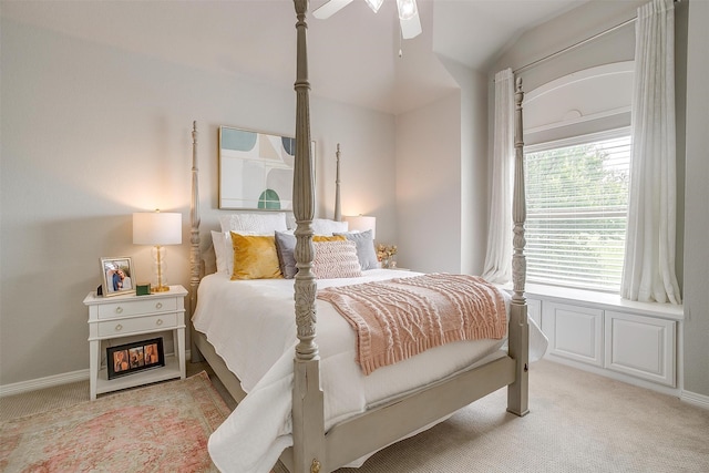 carpeted bedroom with ceiling fan and lofted ceiling