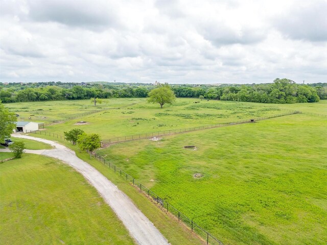 birds eye view of property with a rural view