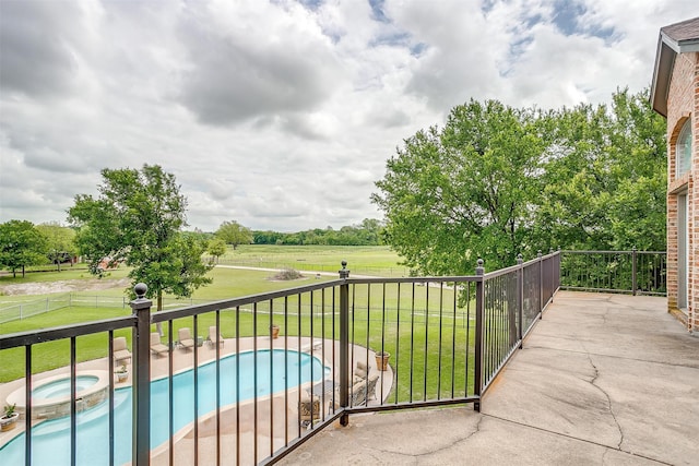 balcony with an in ground hot tub