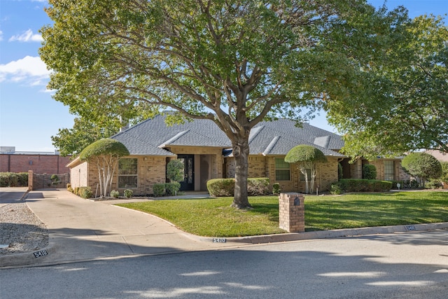 view of front of property with a front lawn