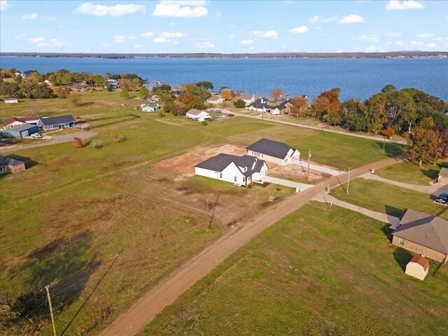 modern farmhouse style home with a lawn and a garage