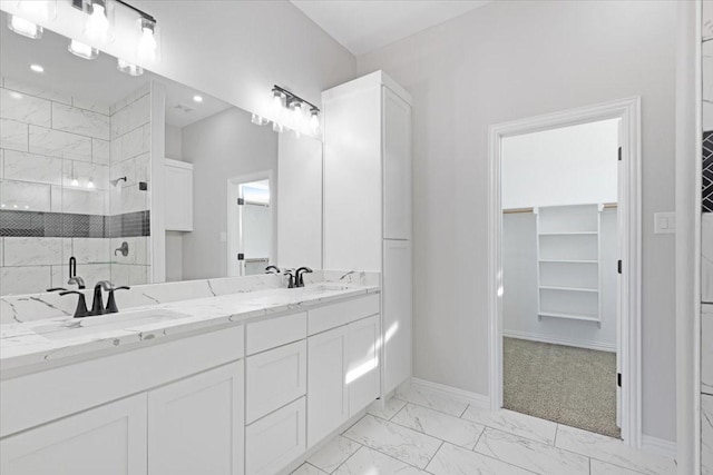 bathroom featuring vanity and a shower