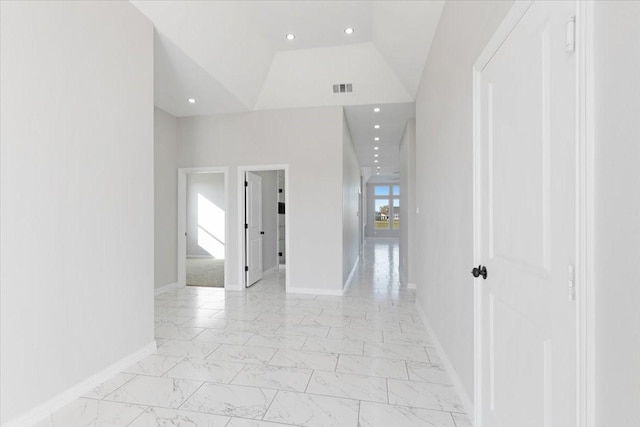 corridor with lofted ceiling