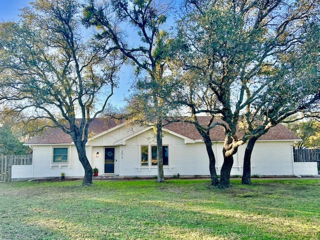 exterior space featuring a yard and fence