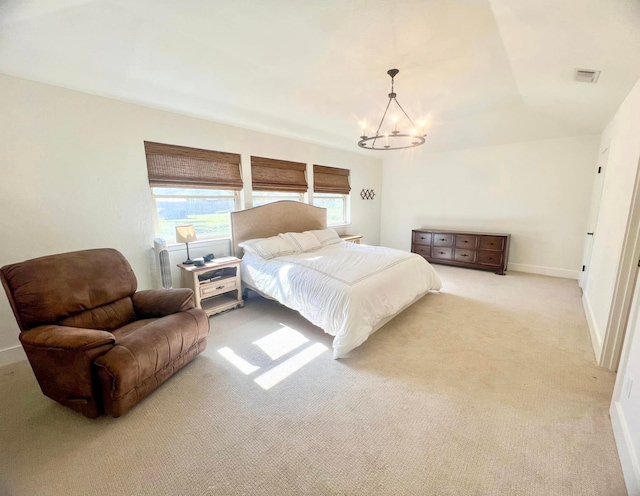 bedroom with visible vents, light colored carpet, baseboards, and an inviting chandelier