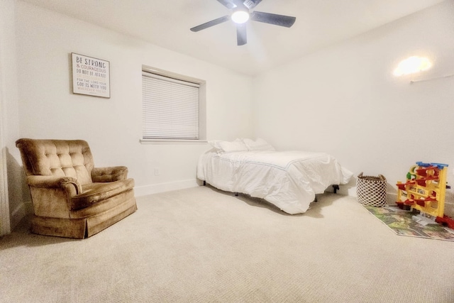 carpeted bedroom featuring ceiling fan and baseboards