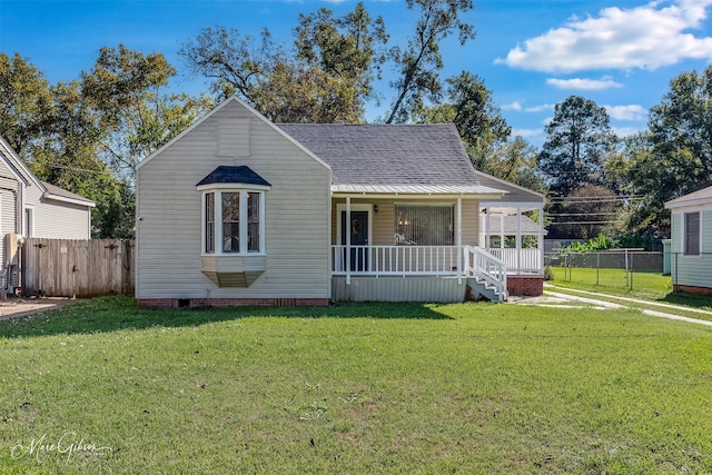 bungalow-style home with covered porch and a front lawn