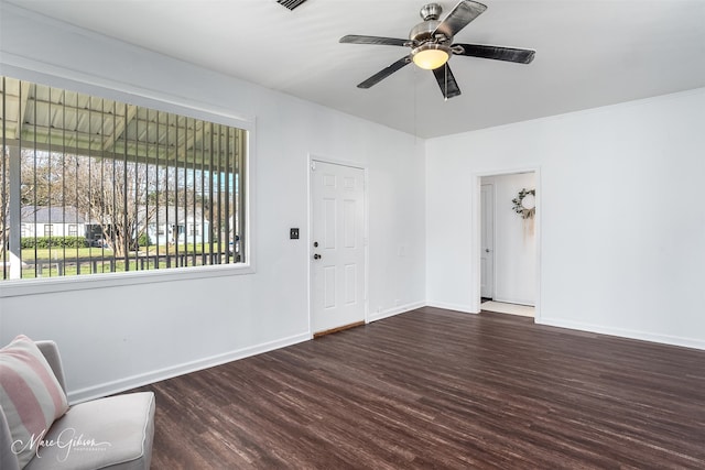 entrance foyer with ceiling fan, dark hardwood / wood-style flooring, and crown molding