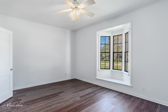 empty room featuring dark hardwood / wood-style floors and ceiling fan