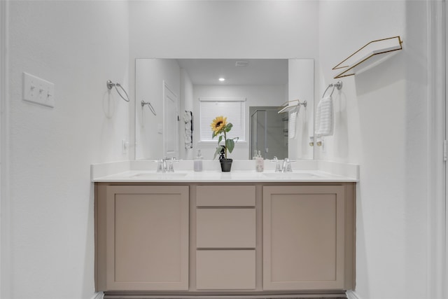 bathroom with vanity and a shower with shower door