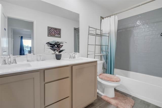 full bathroom featuring wood-type flooring, vanity, toilet, and shower / bathtub combination with curtain