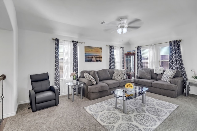 carpeted living room featuring ceiling fan