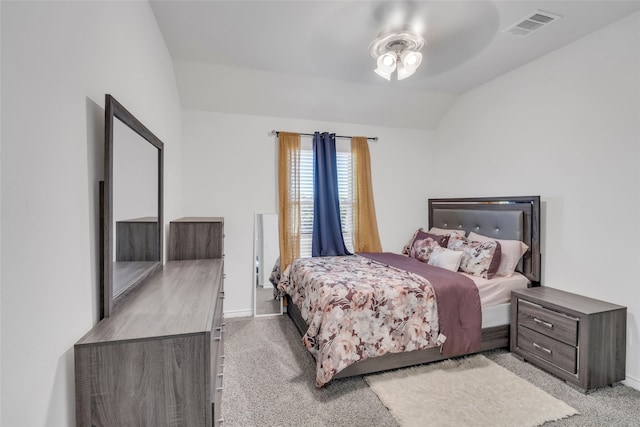 bedroom with light colored carpet, ceiling fan, and lofted ceiling