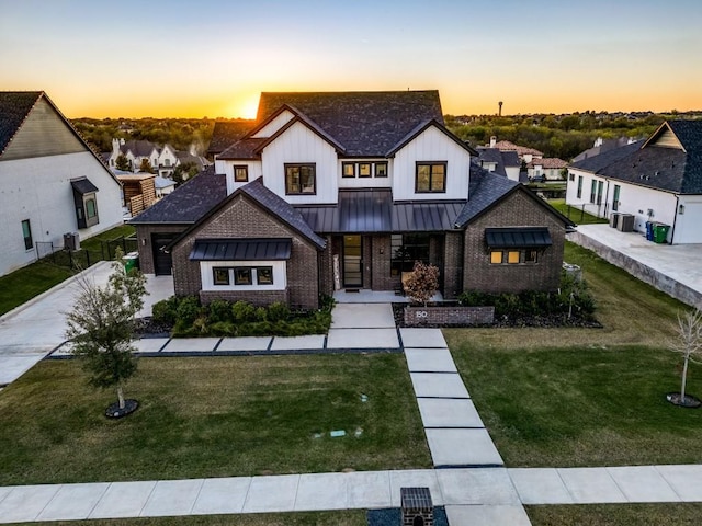 view of front of home with a lawn