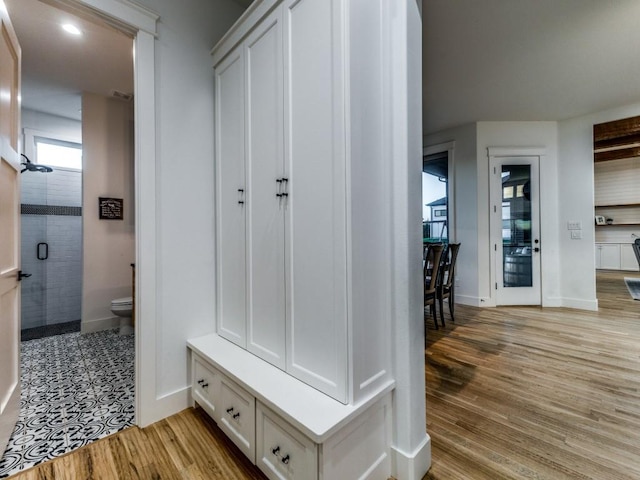 mudroom with light hardwood / wood-style floors