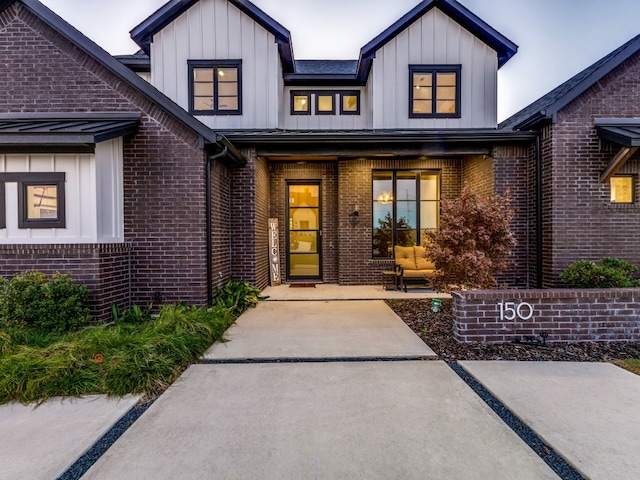 doorway to property with a patio