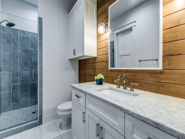 bathroom featuring vanity, an enclosed shower, tile patterned floors, and toilet