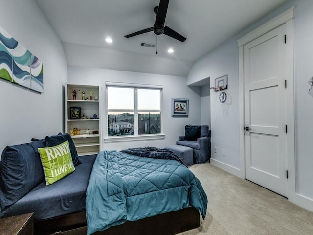 bedroom with lofted ceiling, light colored carpet, and ceiling fan